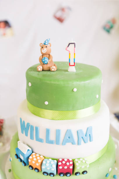 istock Green and White One Year Old Birthday Cake and Candle 994328868