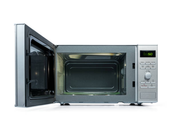 istock Microwave oven with door open, isolated on white background. File contains a path to isolation. 994331522