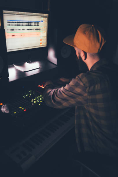 istock DJ producing music using professional audio equipment in music studio 994339238