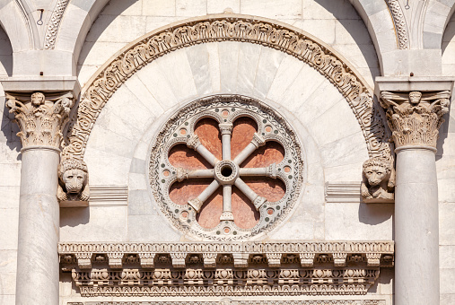 Romanesque facade detail of Roman Catholic basilica San Michele in Foro in Lucca, Tuscany, Italy
