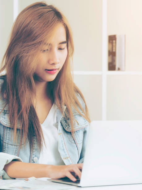 istock Concentrated woman works on computer in home office. 994372060