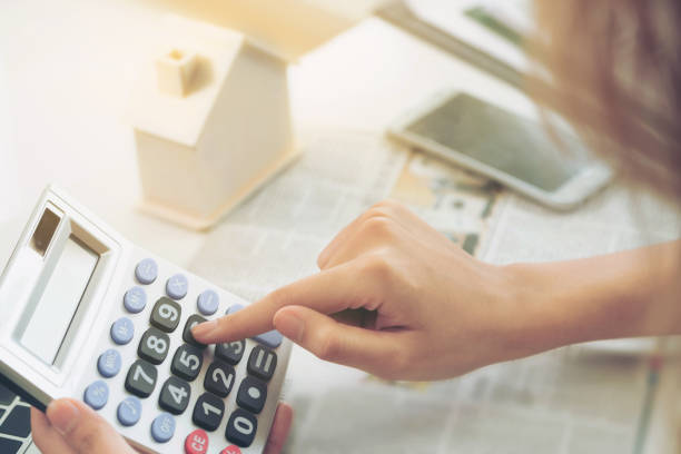 istock Woman accountant or bank worker uses calculator. 994372112