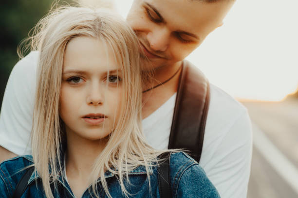 istock Man hugging pretty woman 994377962