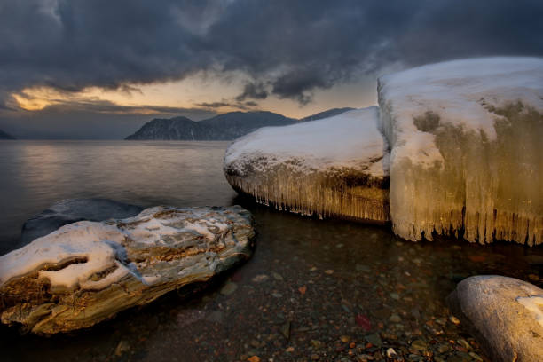 istock Winter sunset on lake Teletskoye. 994379246