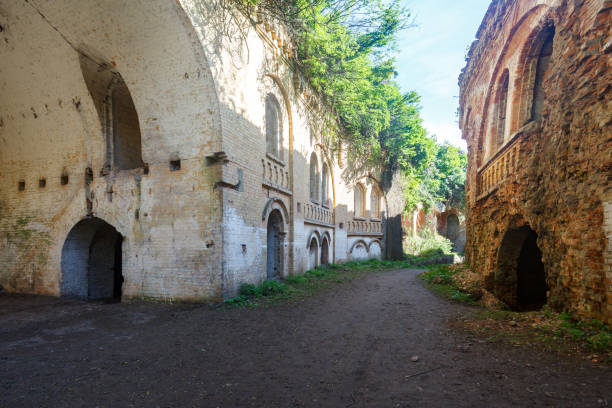 istock old ruined buildings with arches at sunny day 994390476