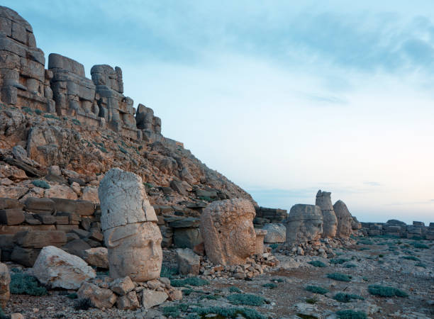 Nemrud dagh. Mount Nemrut, Adiyaman - Turkey B.C. The Antiochus I Theos, King of the Commagene I in 62 BC, is a large statue of 8 to 9 meters (26 to 30 feet) in height, with two lions, two cartoons and various Greek, Armenian, and Zeus-Aramazd or Oromasdes, Hercules-Vahagn, The gods of Medes such as Tyche-Bakht and Apollo-Mihr-Mithras. It is a UNESCO World Heritage site on top of Mount Nemrut in Adiyaman province. Nemrut Mountain is located 40 km north of Kahta near Adiyaman. nemrut dagi stock pictures, royalty-free photos & images