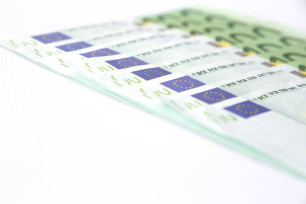 istock Euro banknotes close up. Several hundred euro banknotes on white background 994415398
