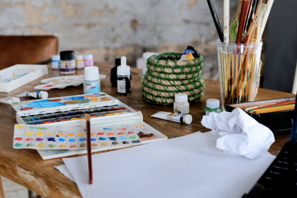 istock Conceptual image of graphic designer workplace, with a pen tablet, a computer and some color swatches 994415754