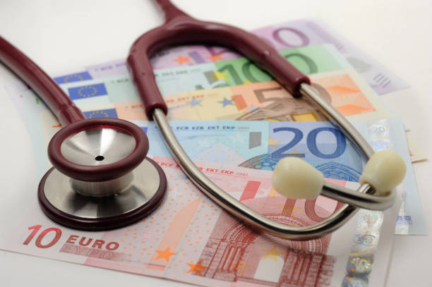 istock medical stethoscope and Euro banknotes 994418420