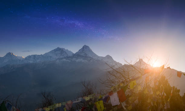 rows of tibetan prayer flags at annapurna base camp road. trekking in himalaya mountains, nepal. nature landscape - nepal landscape hiking rice imagens e fotografias de stock