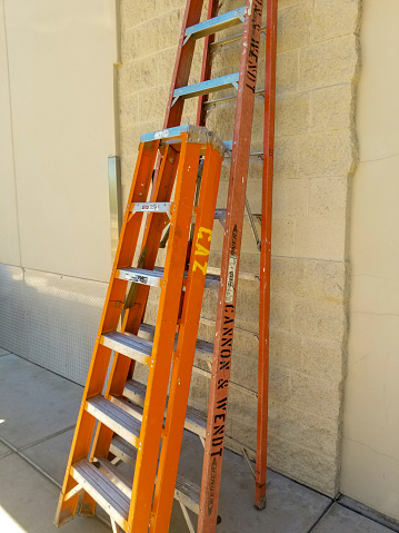 two orange ladders