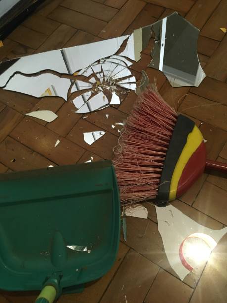 istock Broken mirror over hardwood flooring 994424642