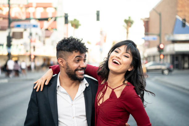 istock Young couple laughing and smiling outdoors 994424954