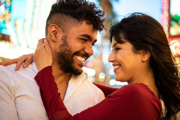 istock Young couple hugging and smiling at each other 994424966