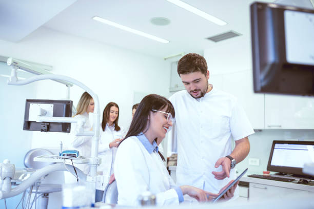 istock Dentists Working On New Results From Latest Surgical Procedures 994425146