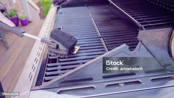 Cleaning Outdoor Gas Grill On Back Patio Stock Photo - Download Image Now - Cleaning, Barbecue Grill, Grilled
