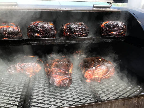 istock Barbecue Pork Butts in a Smoker 994432576