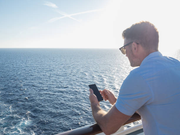 istock Attractive guy on the deck of a cruise ship 994435474