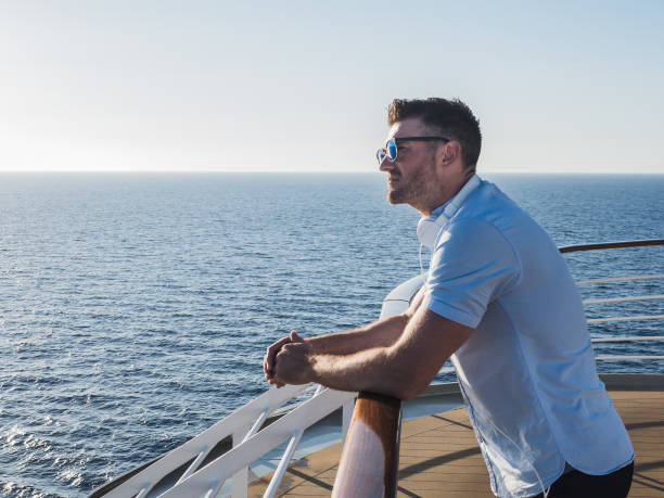 istock Man on the deck of a cruise ship 994440184