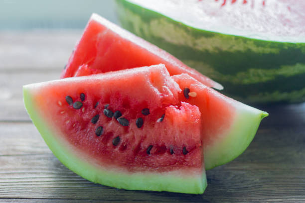 istock juicy watermelon slices on wooden background 994452306