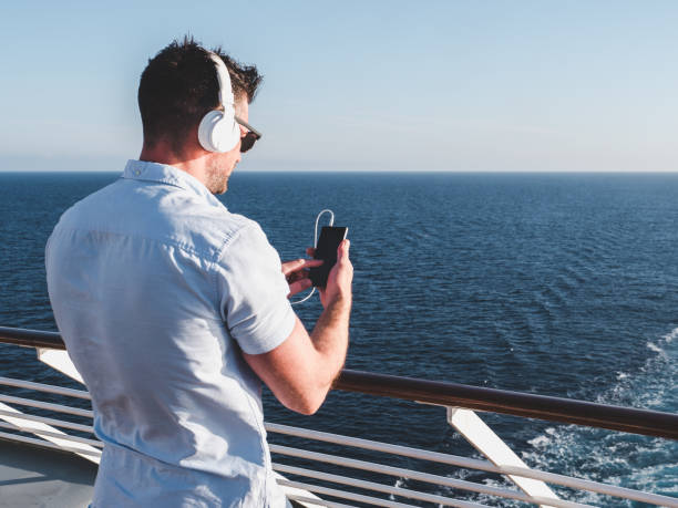 istock Guy on the deck of the cruise ship 994471368