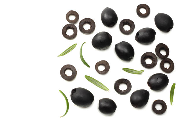 istock Marinated slices black olives isolated on white background. top view 994475526