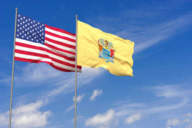 istock USA and New Jersey flags over blue sky background. 3D illustration 994476398