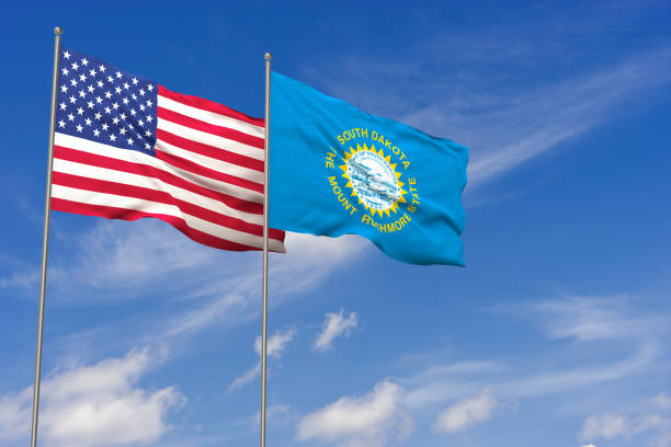 istock USA and South Dakota flags over blue sky background. 3D illustration 994476506
