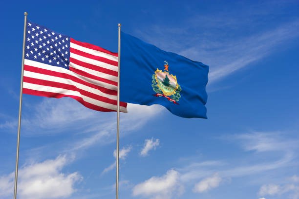 istock USA and Vermont flags over blue sky background. 3D illustration 994476508