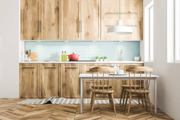 istock Red cooking pot blue and wooden kitchen counter 994482106