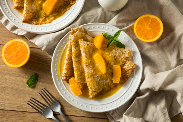 Sweet Homemade Orange Crepes Suzette Sweet Homemade Orange Crepes Suzette for Breakfast crepe stock pictures, royalty-free photos & images