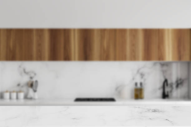 istock White and wooden kitchen countertops blur 994482752