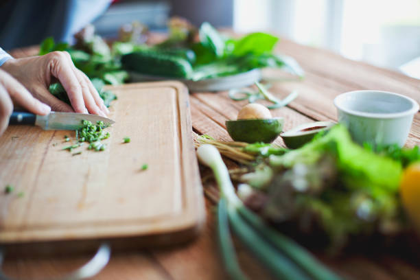 Gourmet chef preparing food in the kitchen. Chopping ingredients to cook a high quality meal