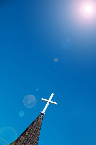istock Tall church steeple with flare and copy space 994500670