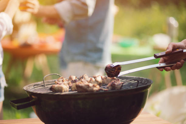 istock Meat frying on grill outdoors 994509934