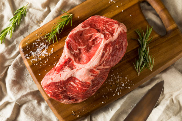 Raw Red Grass Fed Chuck Beef Roast Raw Red Grass Fed Chuck Beef Roast Ready to Cook boneless chuck steak stock pictures, royalty-free photos & images