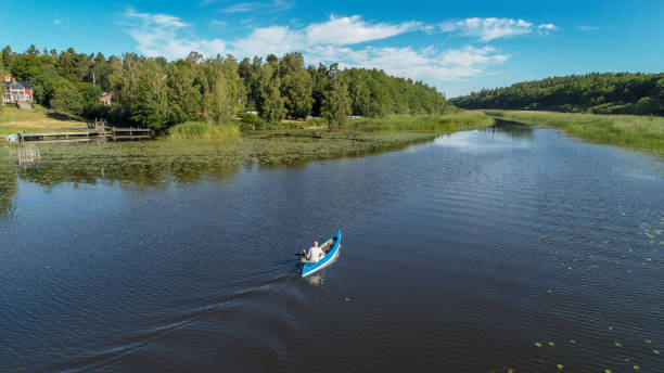 istock Aerial view over a canoe driven by a trolling motor. 994522574