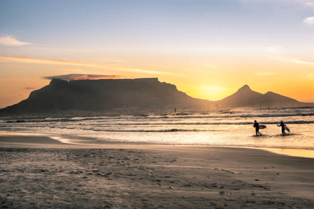 Beautiful sunset over Cape Town's table Mountain Backdrop of one of the 7 Wonders of Nature, Cape Towns majestic table mountain. signal hill stock pictures, royalty-free photos & images
