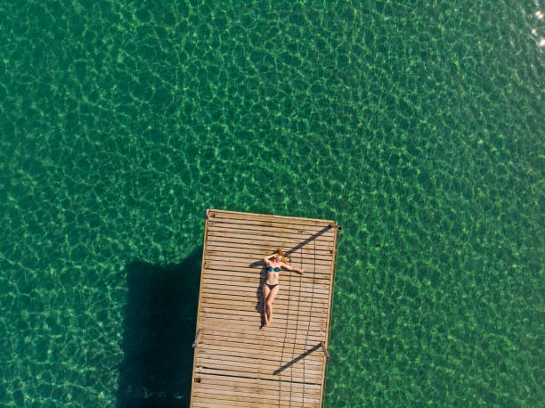 istock Young Woman Relaxing at The Sea 994551644