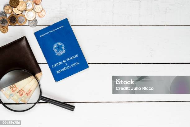 Wallet With Brazilian Money Notes Brazilian Coins Magnifying Glasses And Work Permit On White Background Stock Photo - Download Image Now