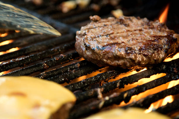 istock Hamburger cooking on the grill 994558834