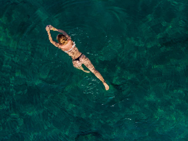istock Young Woman Relaxing at The Sea 994565220