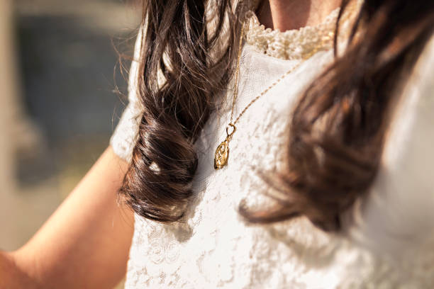 Girl dressed in First communion accessories, Pendant stock photo