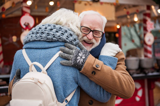 istock Glad pensioner cuddling in city 994586534