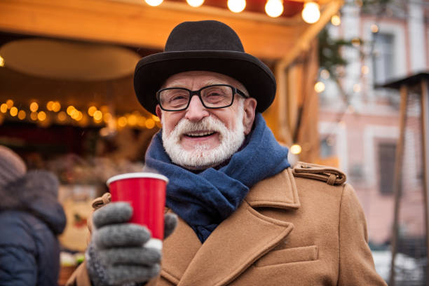 istock Excited mature man drinking hot beverage outdoor 994586696
