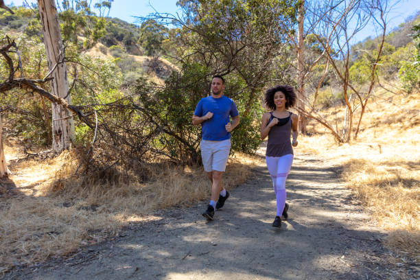istock Couple Running in Los Angeles Park 994596262