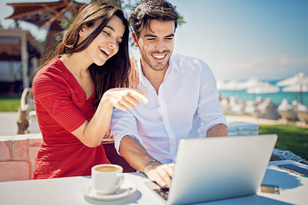 istock Couple is hugging and browsing on the beach 994596402