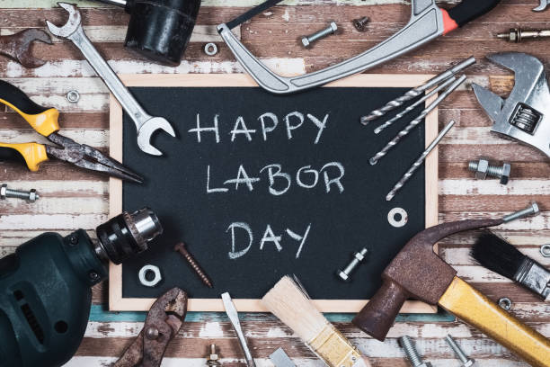 istock Chalk board with text HAPPY LABOR DAY with variety gruge rusty handy tools on a rusty wooden table. 994632162