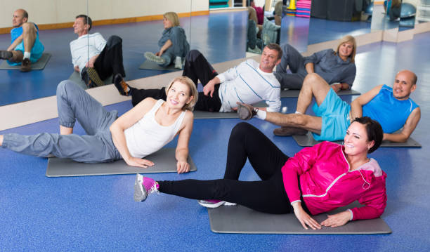 istock people training in a gym on sport mats 994636858