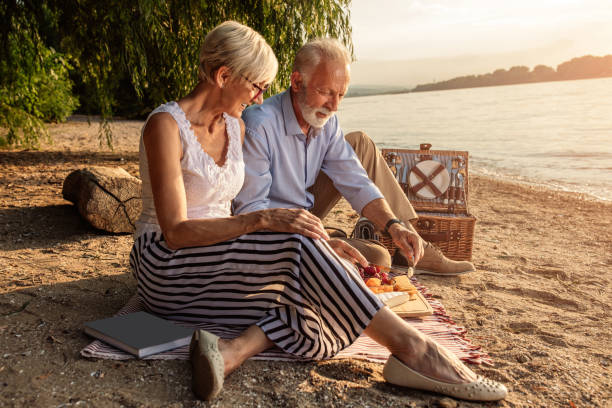 istock Enjoying a romantic picnic at the beach 994641870